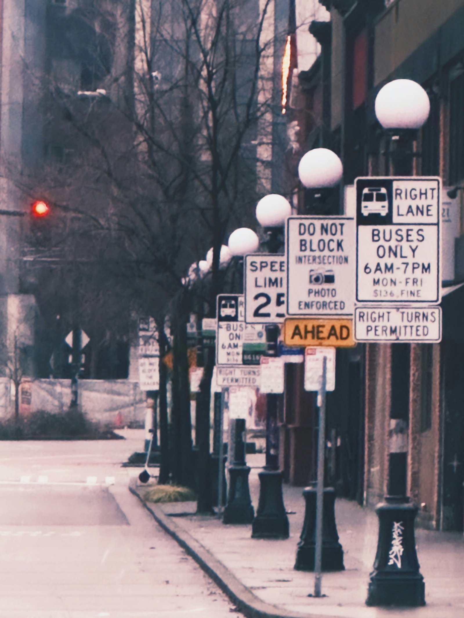 a city street filled with lots of street signs